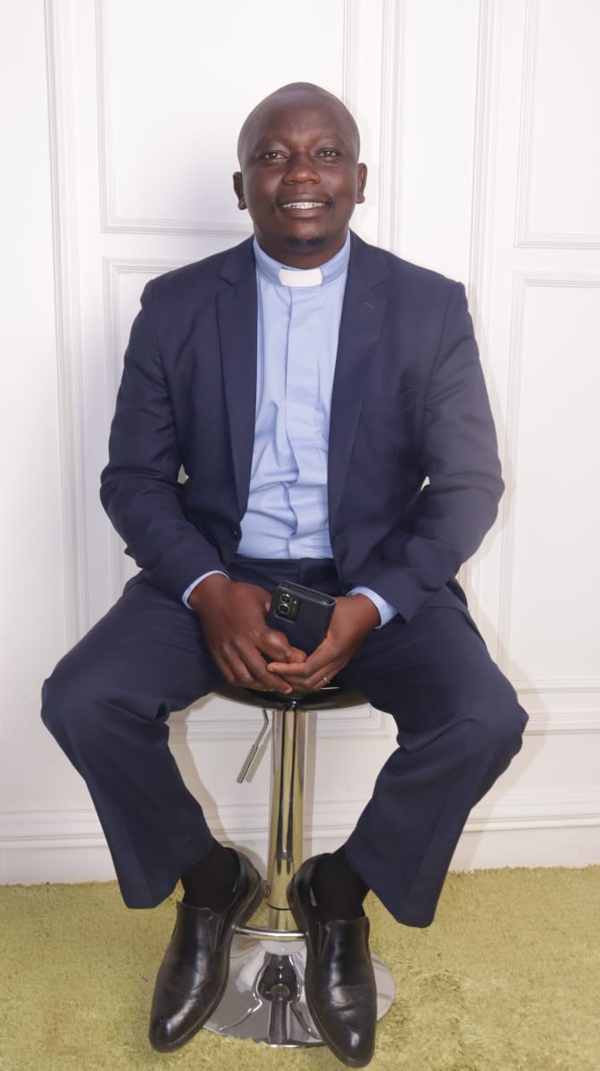 Portrait Pastor Navy Suit Seated Pose Front