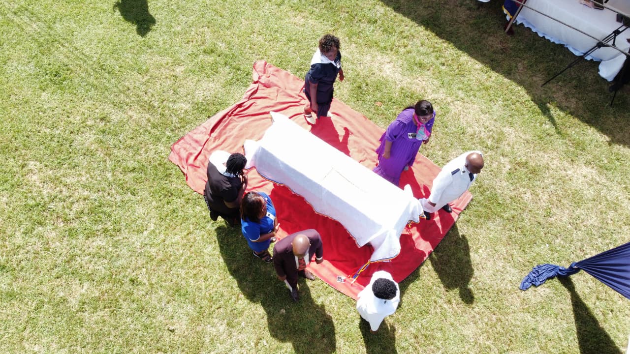 Drone Aerial Casket Covered White Cloth Carried